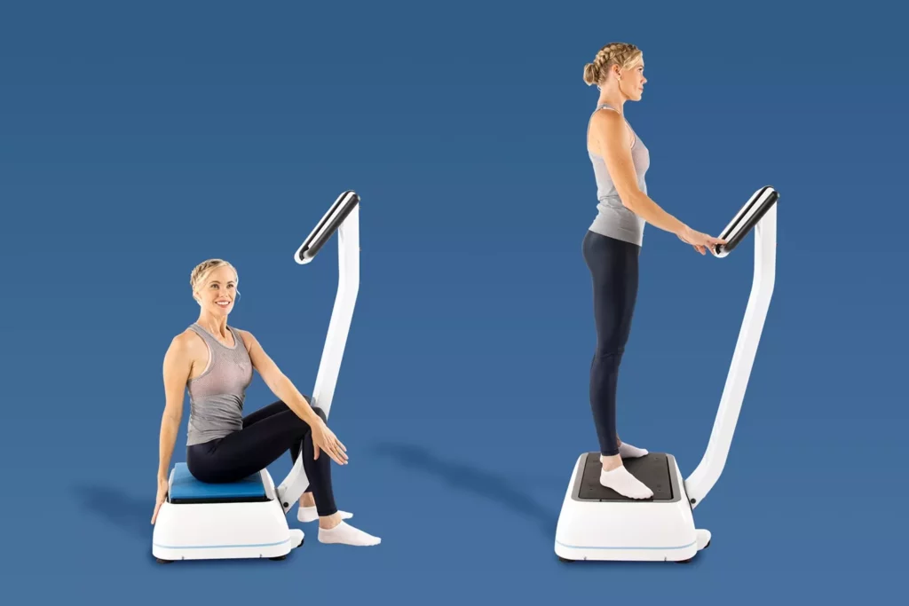 How To Use A Vibration Plate For Back Pain: Positions, Timings And Real-World Hypervibe Routines 16 Side-by-side comparison of a woman sitting on a vibration plate with a blue cushion and standing upright on a vibration plate.
