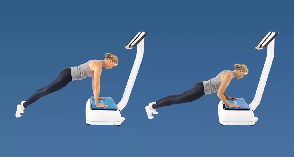woman performing pushups on a vibration plate