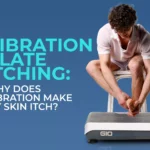 A man with one leg on a vibration plate scratching his foot